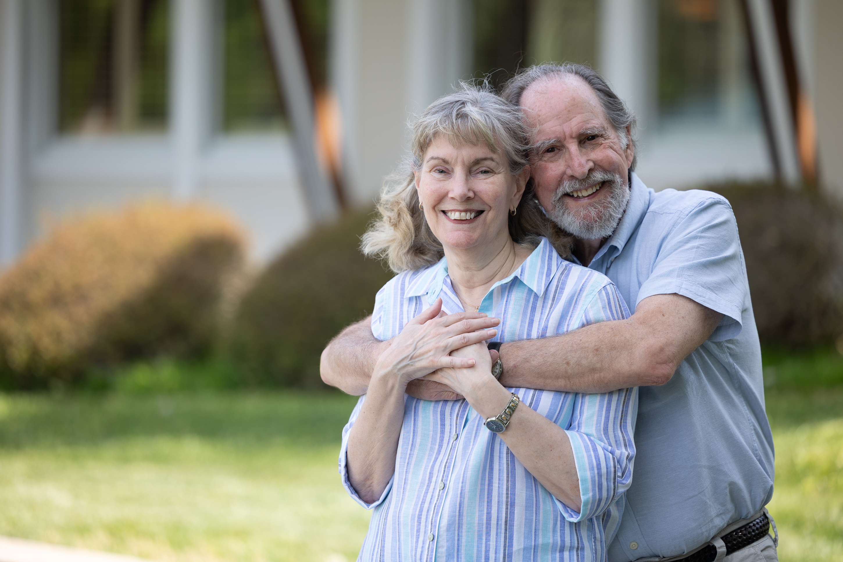 Smiling senior couple embracing outdoors