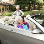 A man and a woman get ready to drive around town