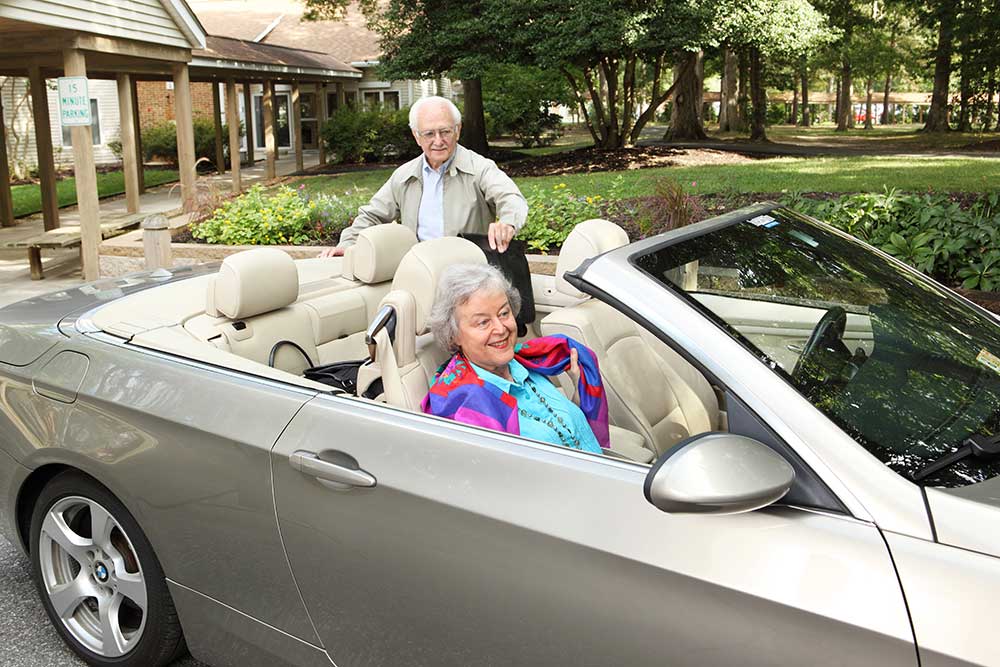 A man and a woman get ready to drive around town