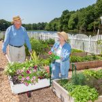 A couple enjoys working in our community garden