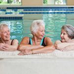 Three ladies enjoy a relaxing dip in our fitness center pool