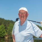 A man pauses while enjoying a round of golf