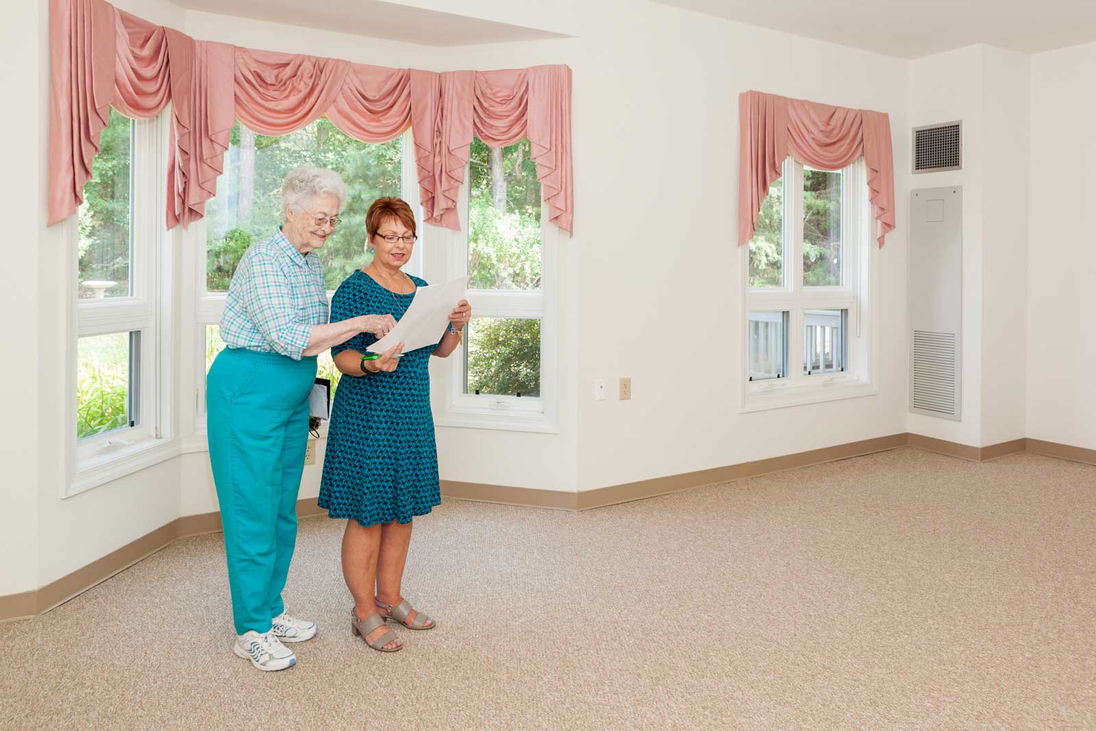 One of our staff shows an apartment to a prospective resident