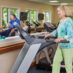 A woman uses the treadmill in our fitness center