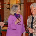 Three ladies enjoy cocktails and conversation at the pub