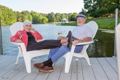 Couple relaxing on dock