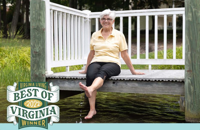 A resident dips their toes in our lake