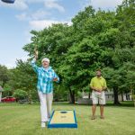 Couple playing corn hole