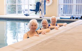 senior women swimming in a pool