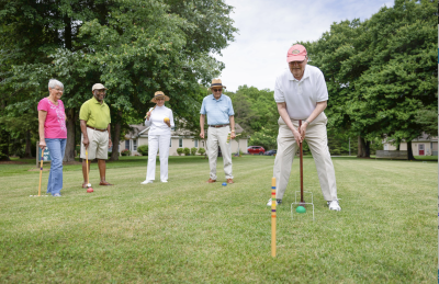 seniors playing croquet