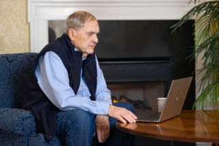 senior man using laptop