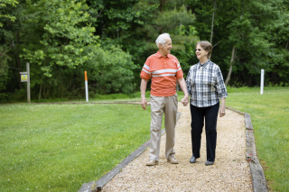 senior couple walking outside