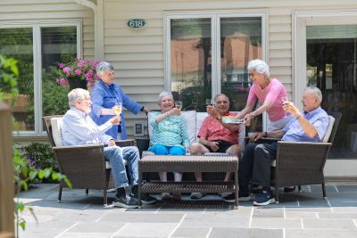 Seniors enjoying time outside on their patio