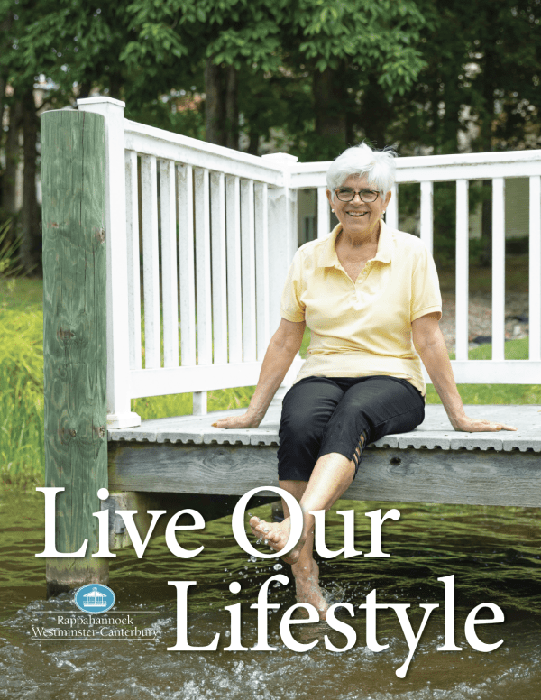 Smiling senior woman sitting on dock over water