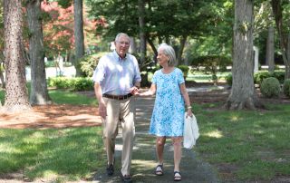 senior couple walking outside