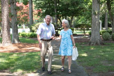 senior couple walking outside