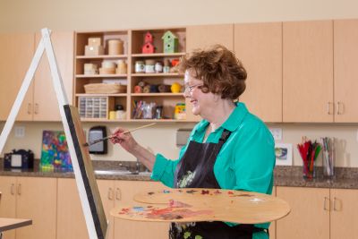 senior woman painting