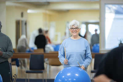 woman drumming on yoga ball