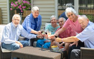 group of seniors sharing a toast
