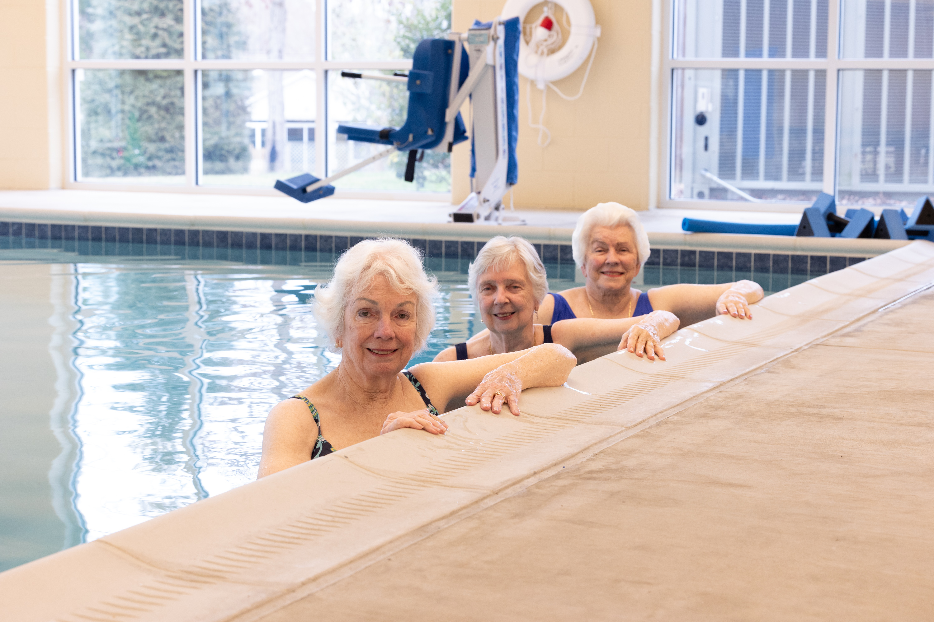 senior women swimming in a pool