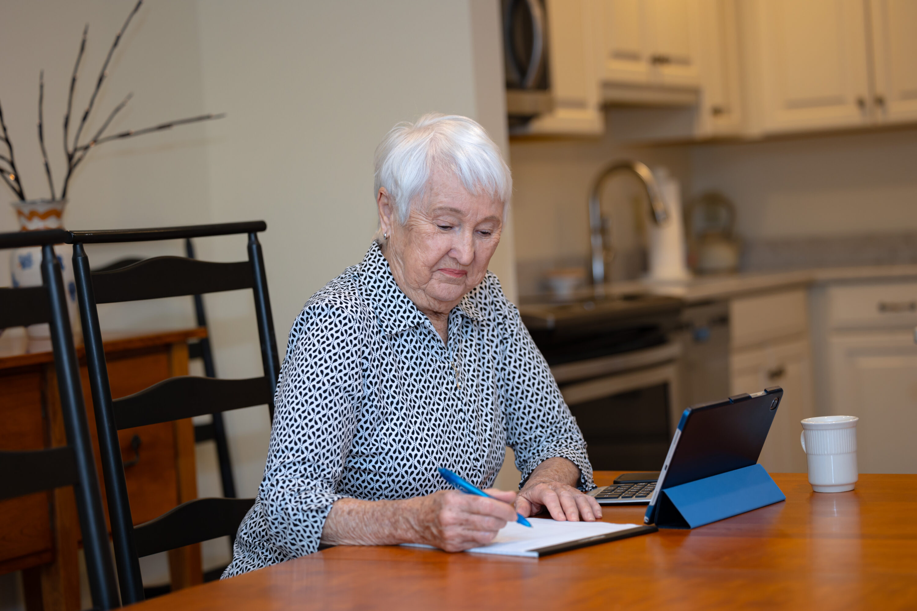 senior woman at desk working