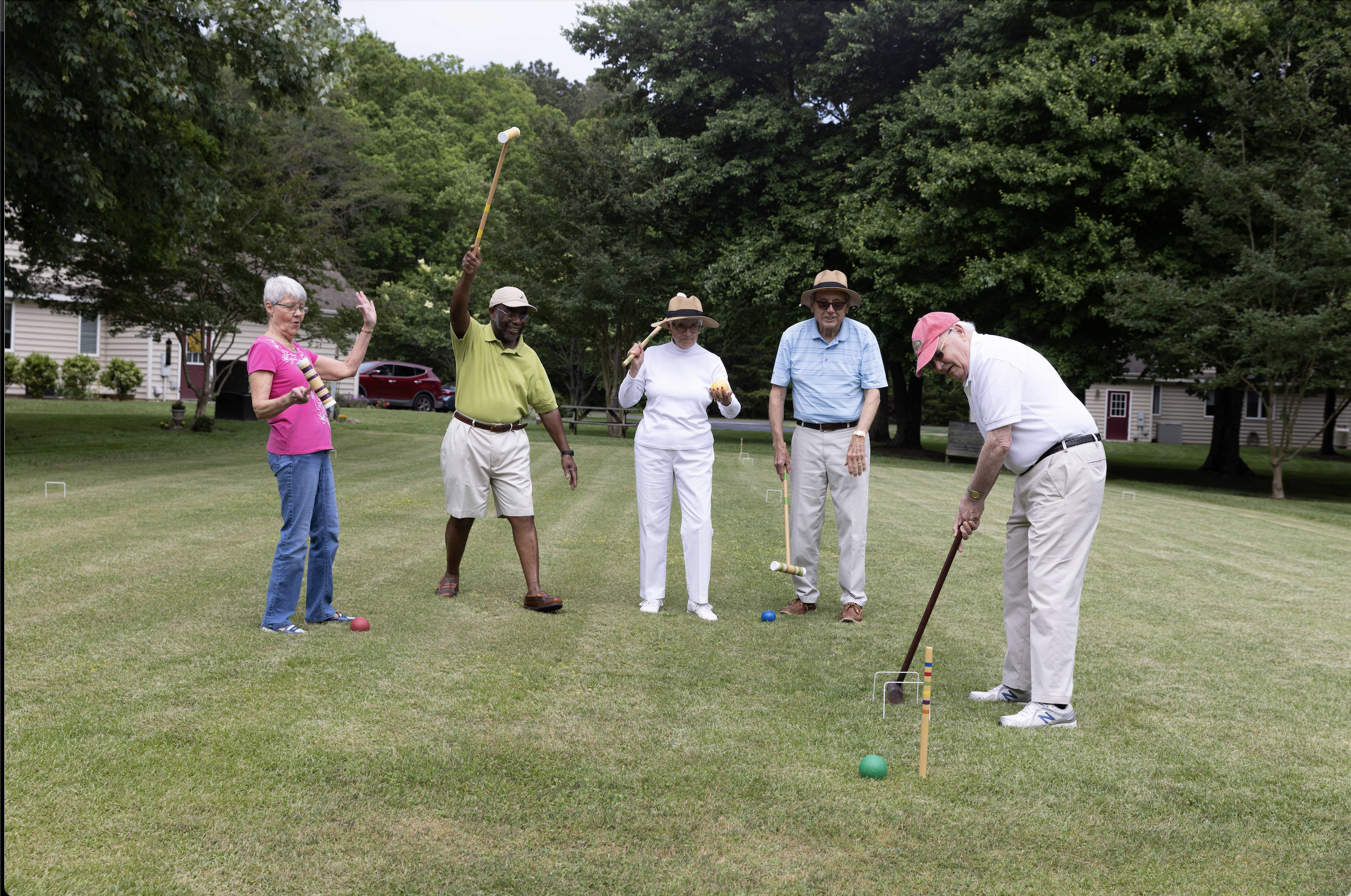 Group of seniors playing croquet