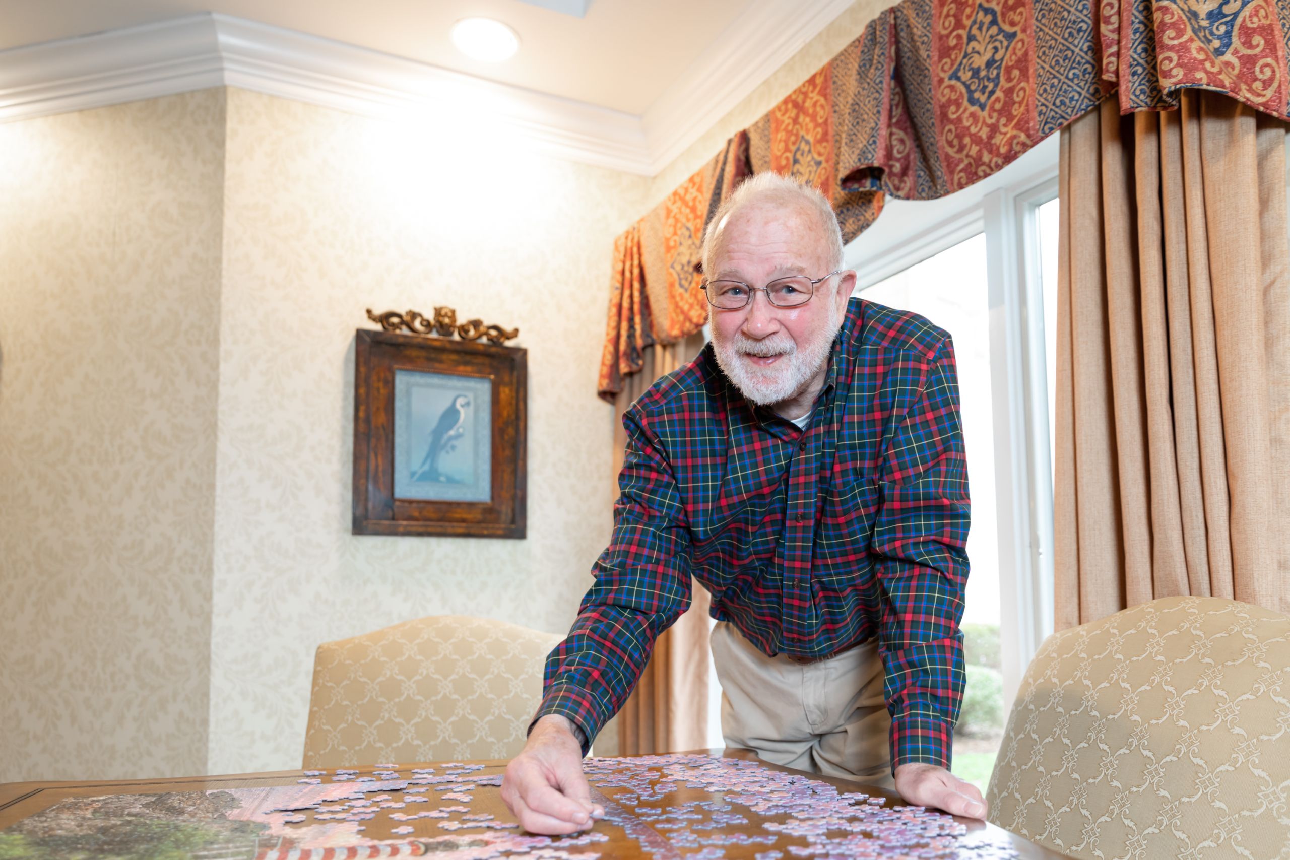 Man putting a puzzle together