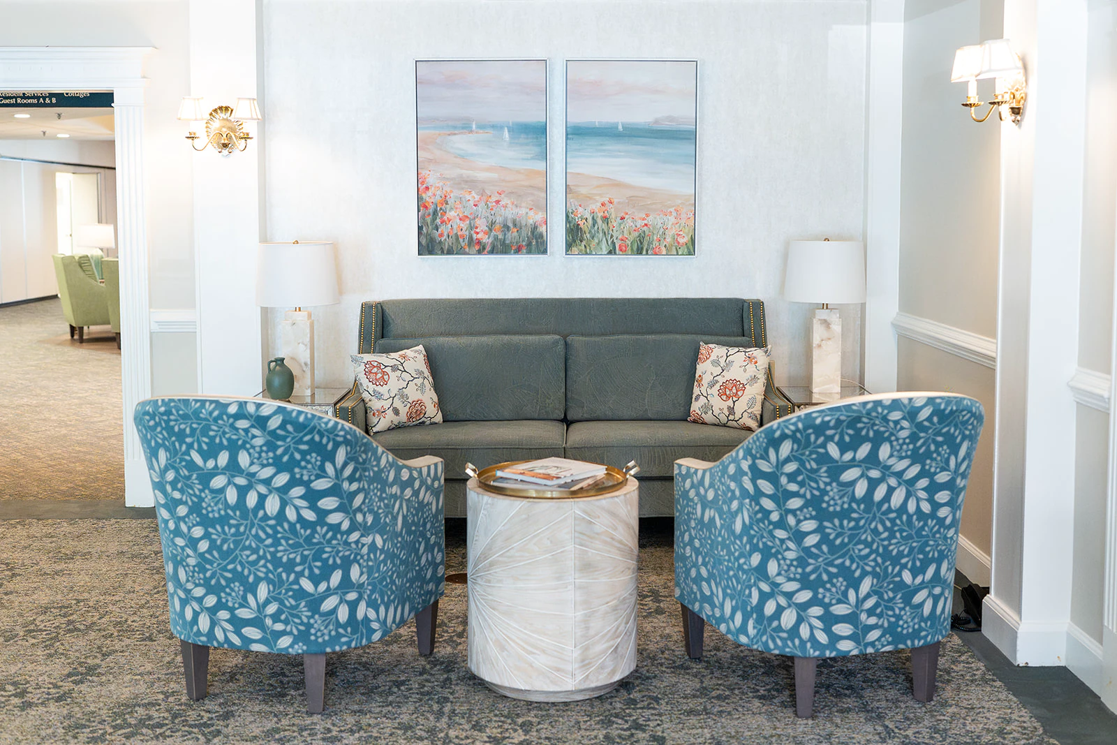 Cozy lobby seating with sofa and blue chairs