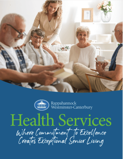 Caregiver assisting seniors in bright living room