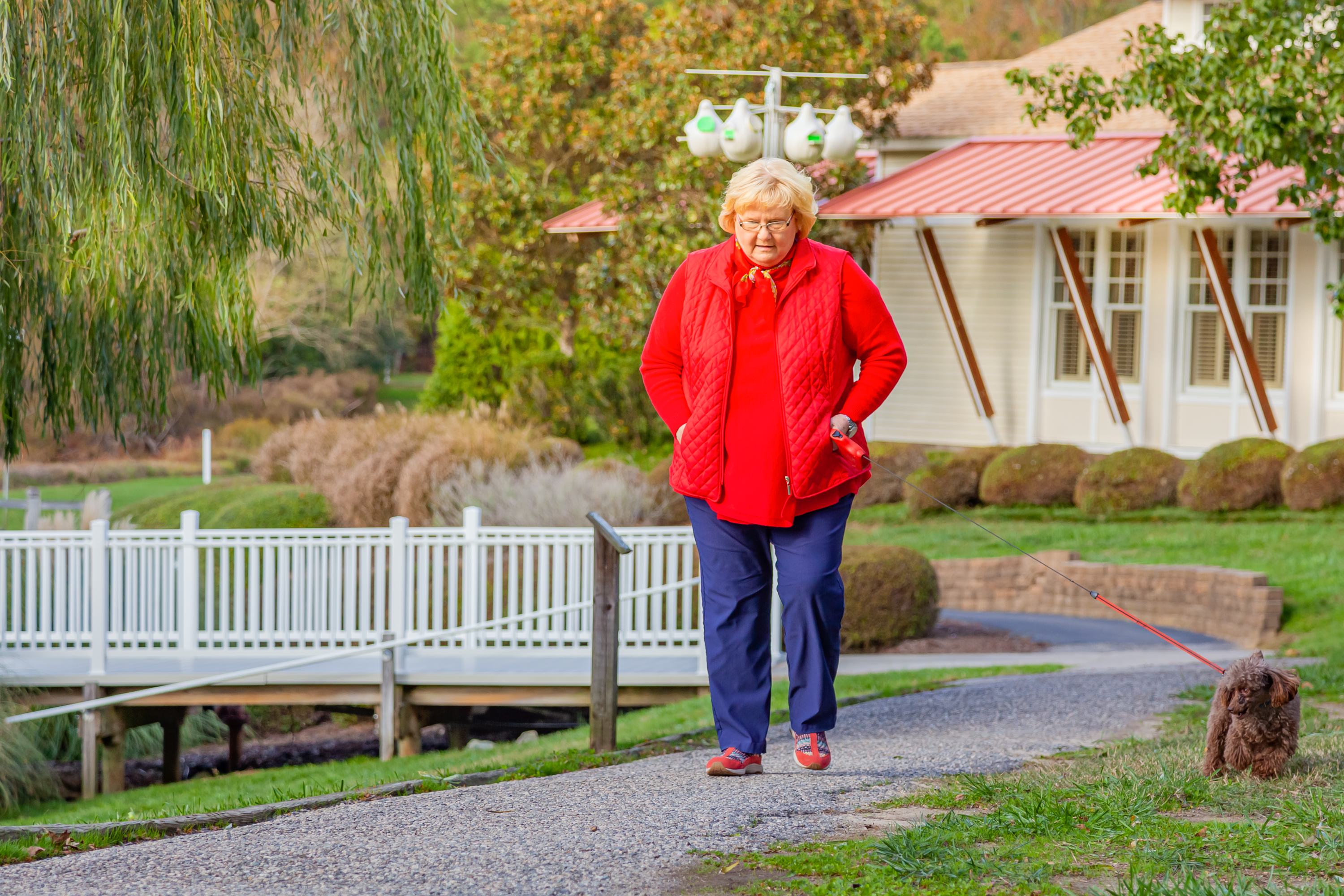 senior woman walking outside on a cold day