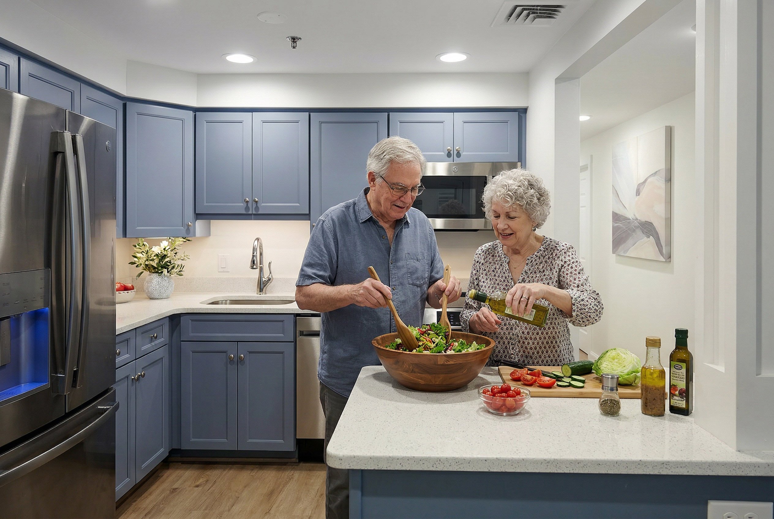 Senior couple preparing salad in modern kitchen