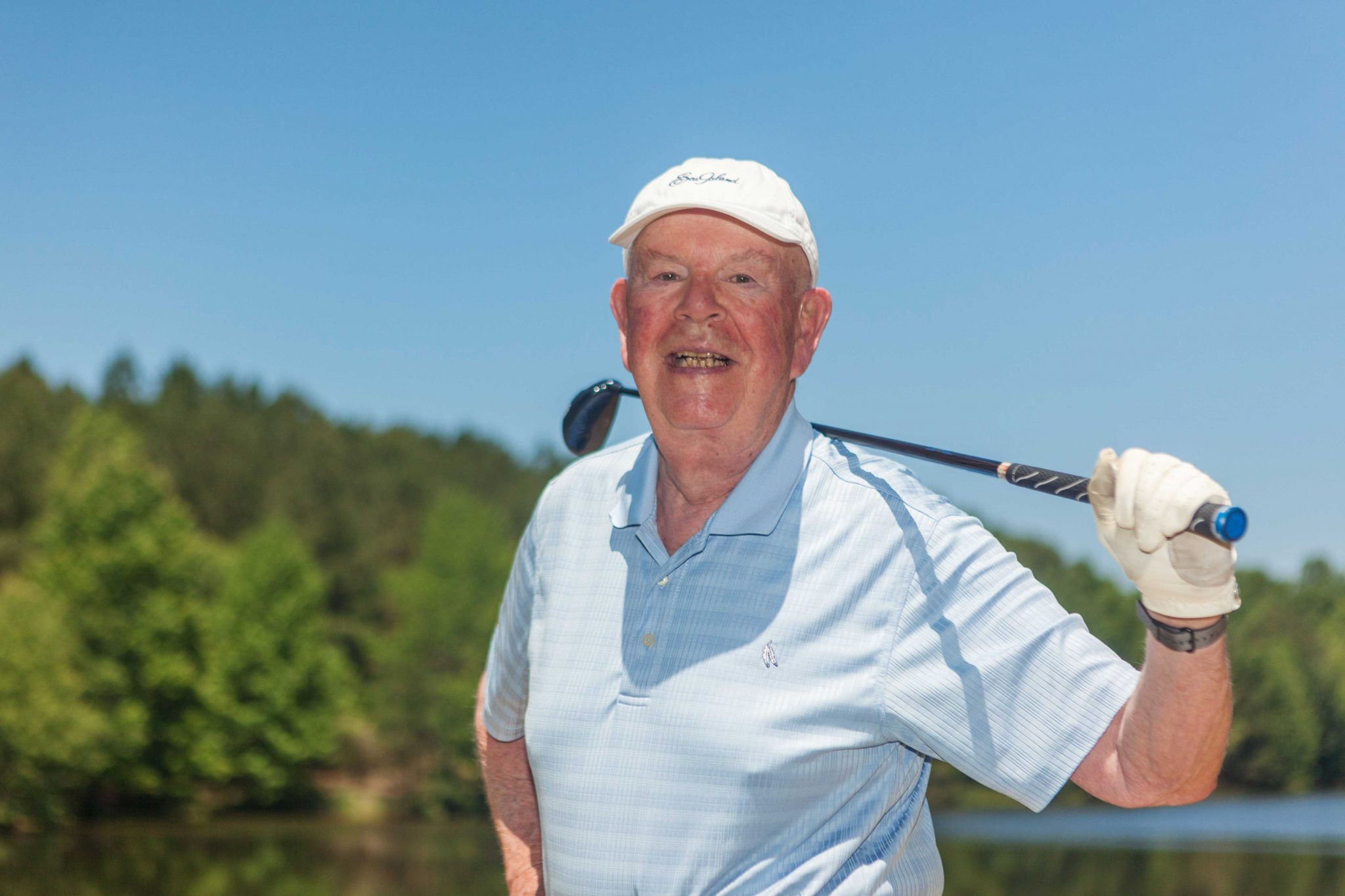 A man pauses while enjoying a round of golf