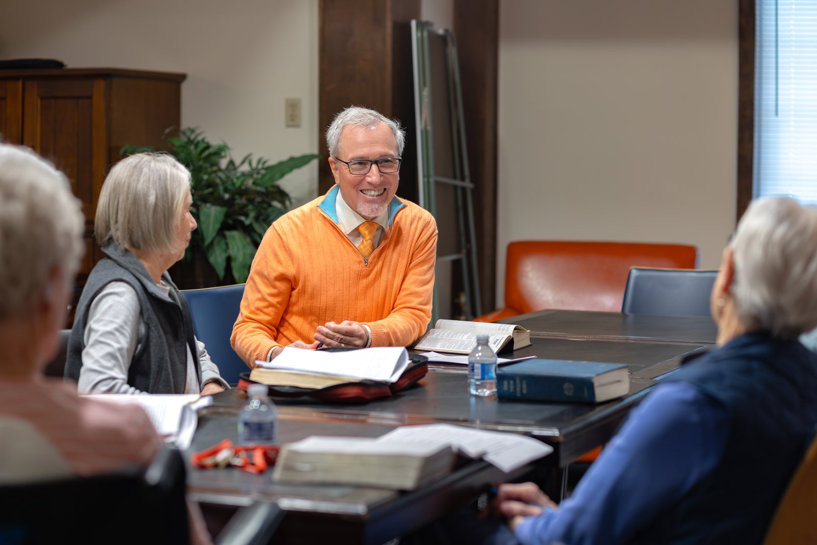Small group Bible study meeting around table