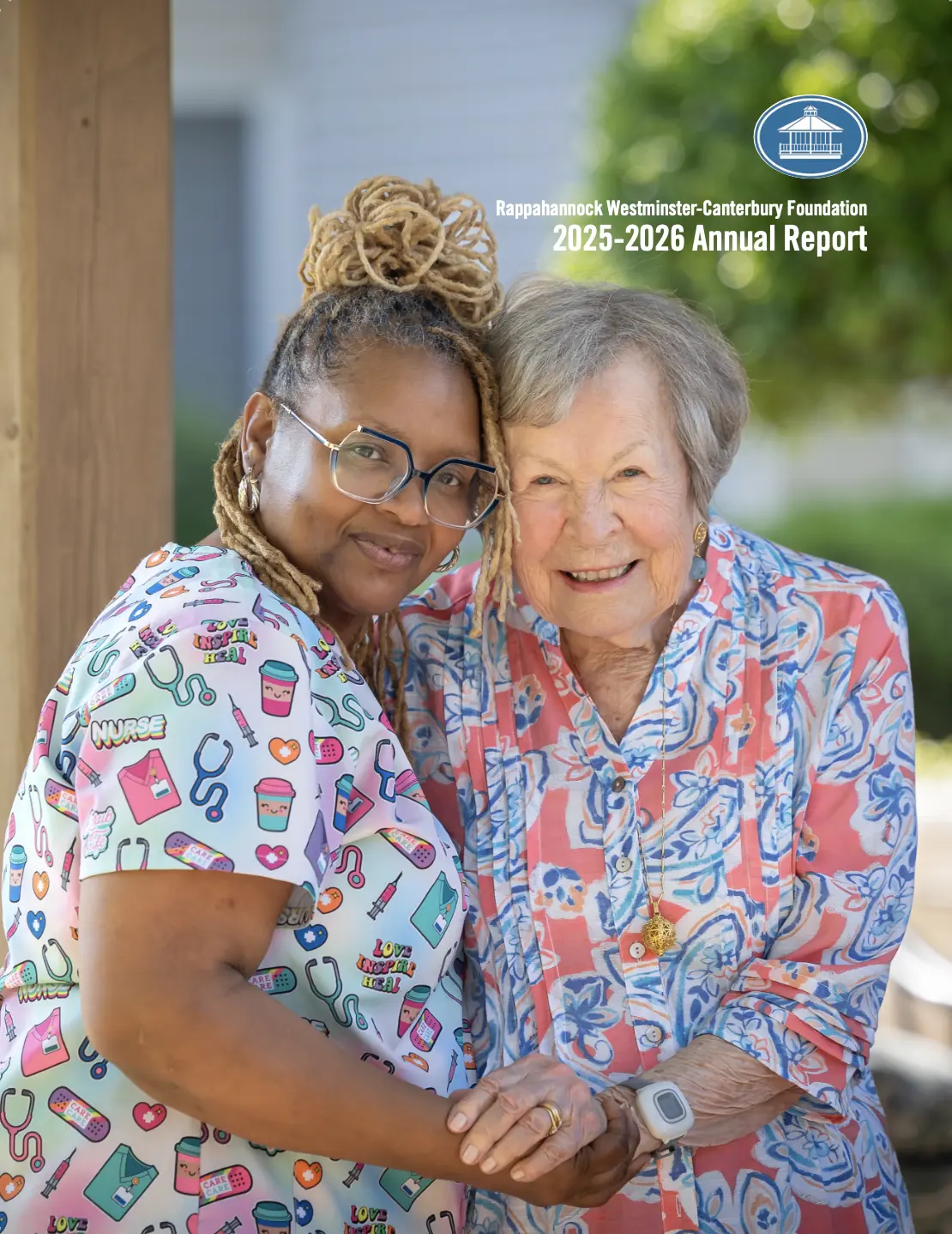 Caregiver and smiling senior woman holding hands
